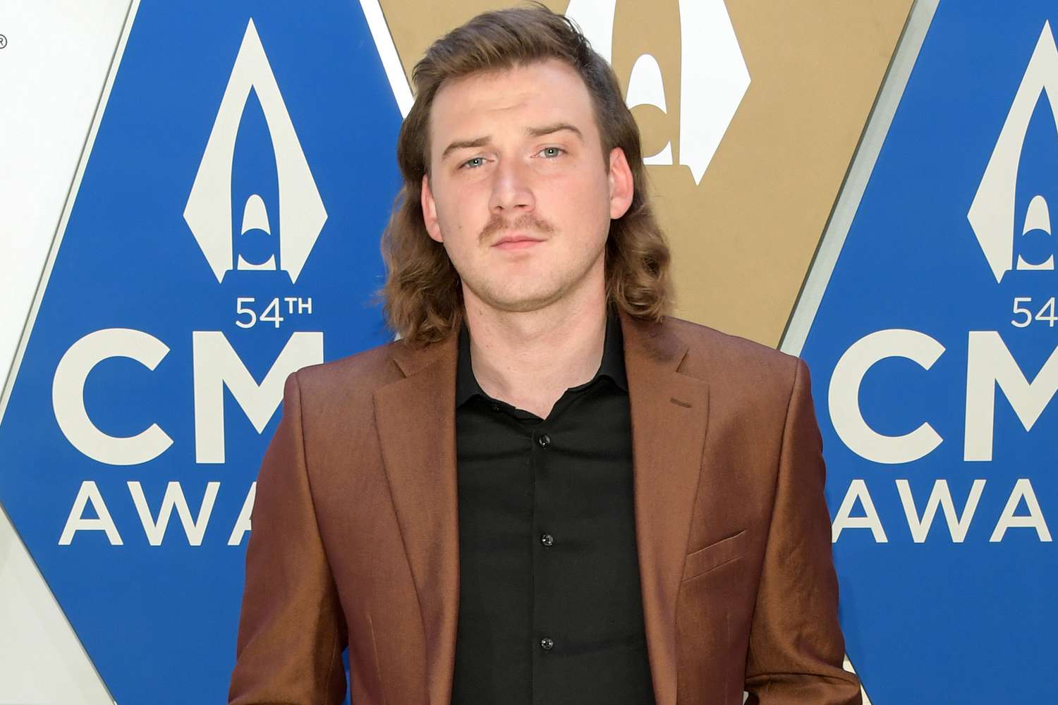 Morgan Wallen faces legal action and cancels shows due to vocal rest.