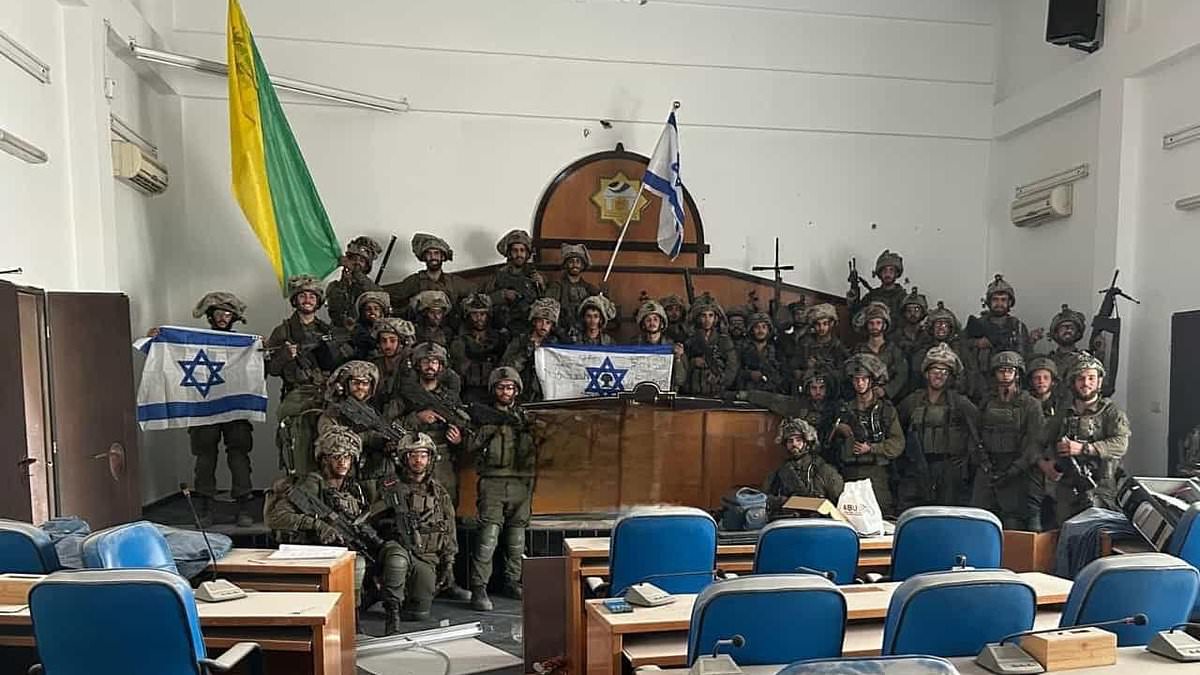 "Israeli Troops Display Firepower in Gaza's Parliament Building Ahead of Hamas Tunnel Offensive"