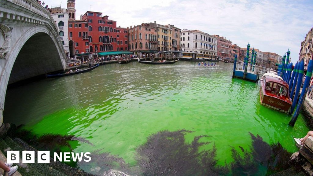 Venice's Grand Canal mysteriously glows fluorescent green, police investigate.