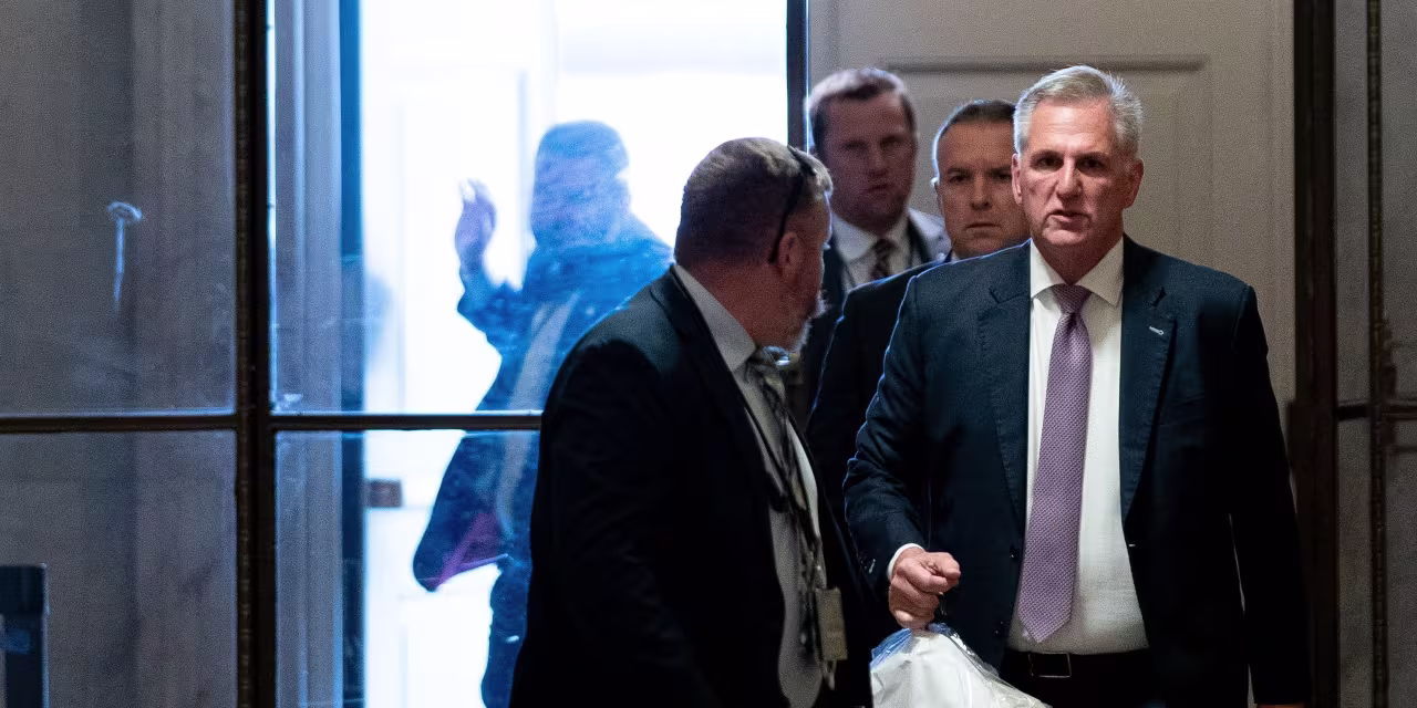 "McCarthy's Plan to Avoid Shutdown: Combining Funding Bills and Facing Fire from Freedom Caucus"
