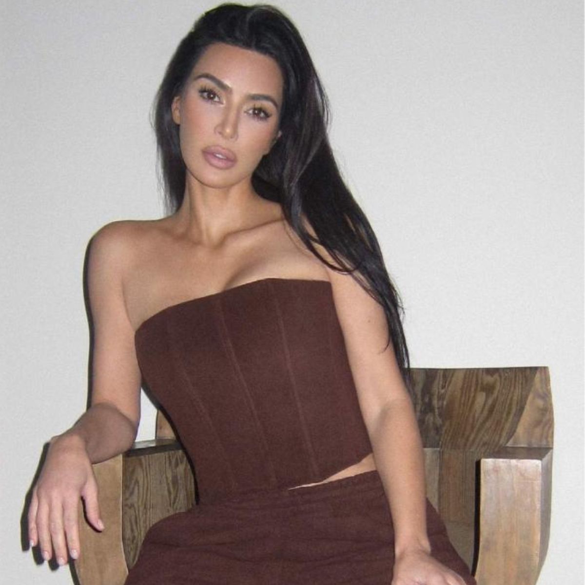 Featured image for Kim Kardashian Stuns in New Curly Blonde Bob and Swim Collection