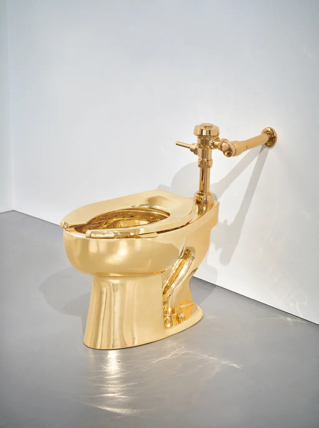 Featured image for Sotheby’s Auctions Maurizio Cattelan’s $10 Million Gold Toilet