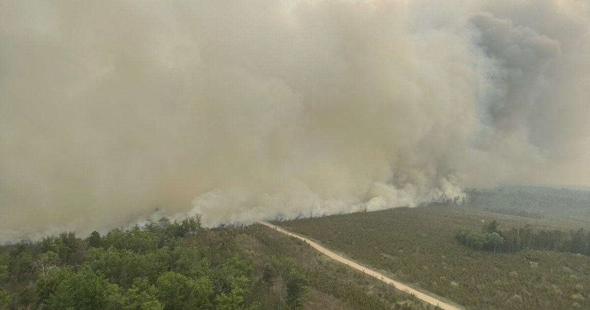 "Wildfire forces evacuations and flight restrictions in Northern Michigan"