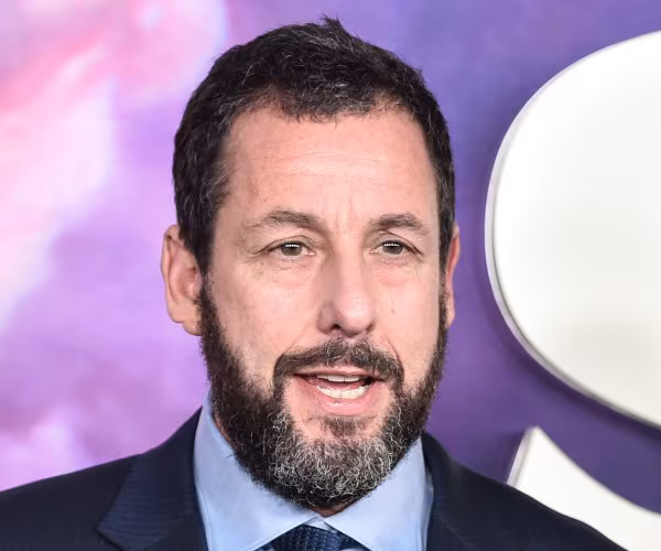 Featured image for "Adam Sandler Pays Tribute to 'Happy Gilmore' Co-star Joe Flaherty"