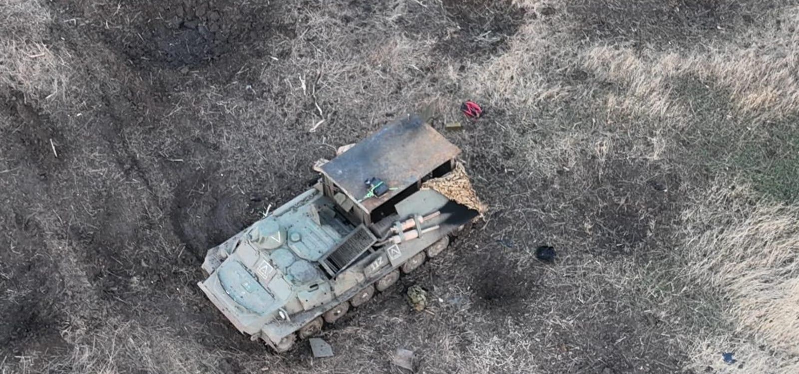 Russian Troops Utilize Backpack Drone-Jammers and Unleash Army of Robots in Ukraine's Electronic Warfare