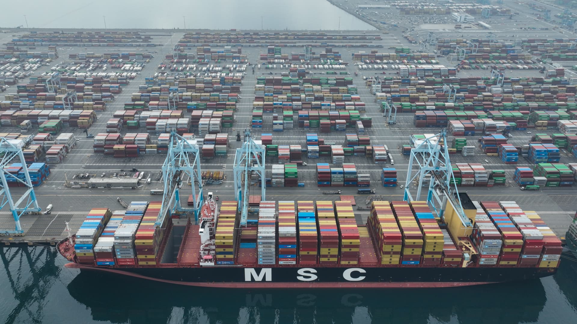 Featured image for West Coast port labor dispute causes disruptions and calls for White House intervention.