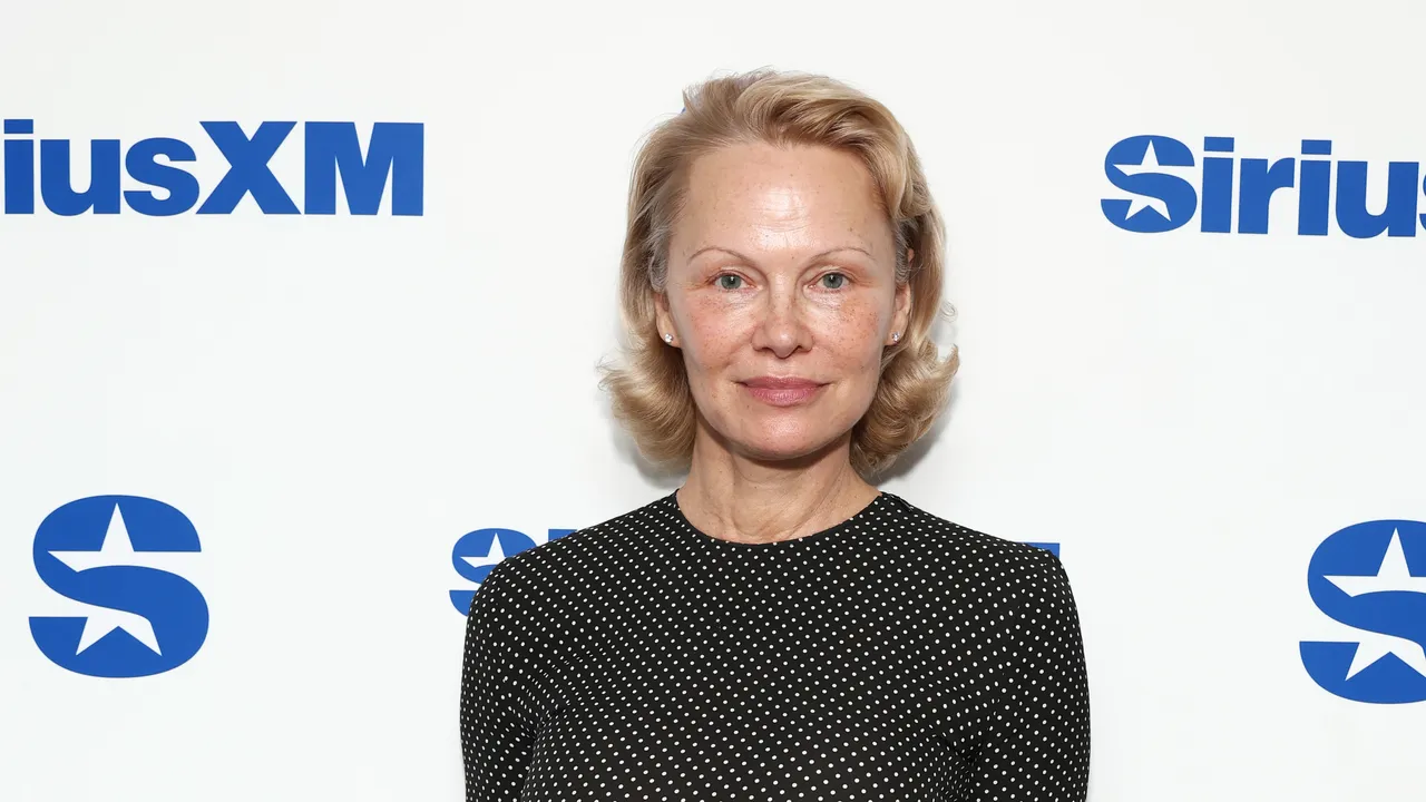 Featured image for Pamela Anderson Unveils Bold New Copper Red Hair Transformation