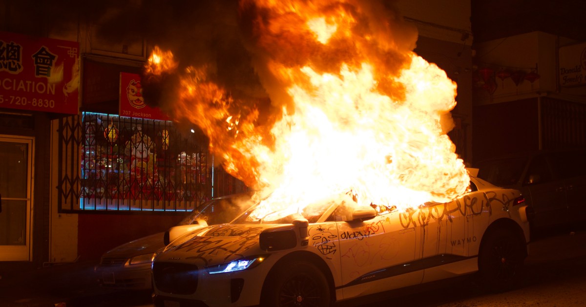 Featured image for "San Francisco Mob Sets Fire to Waymo's Driverless Vehicle"