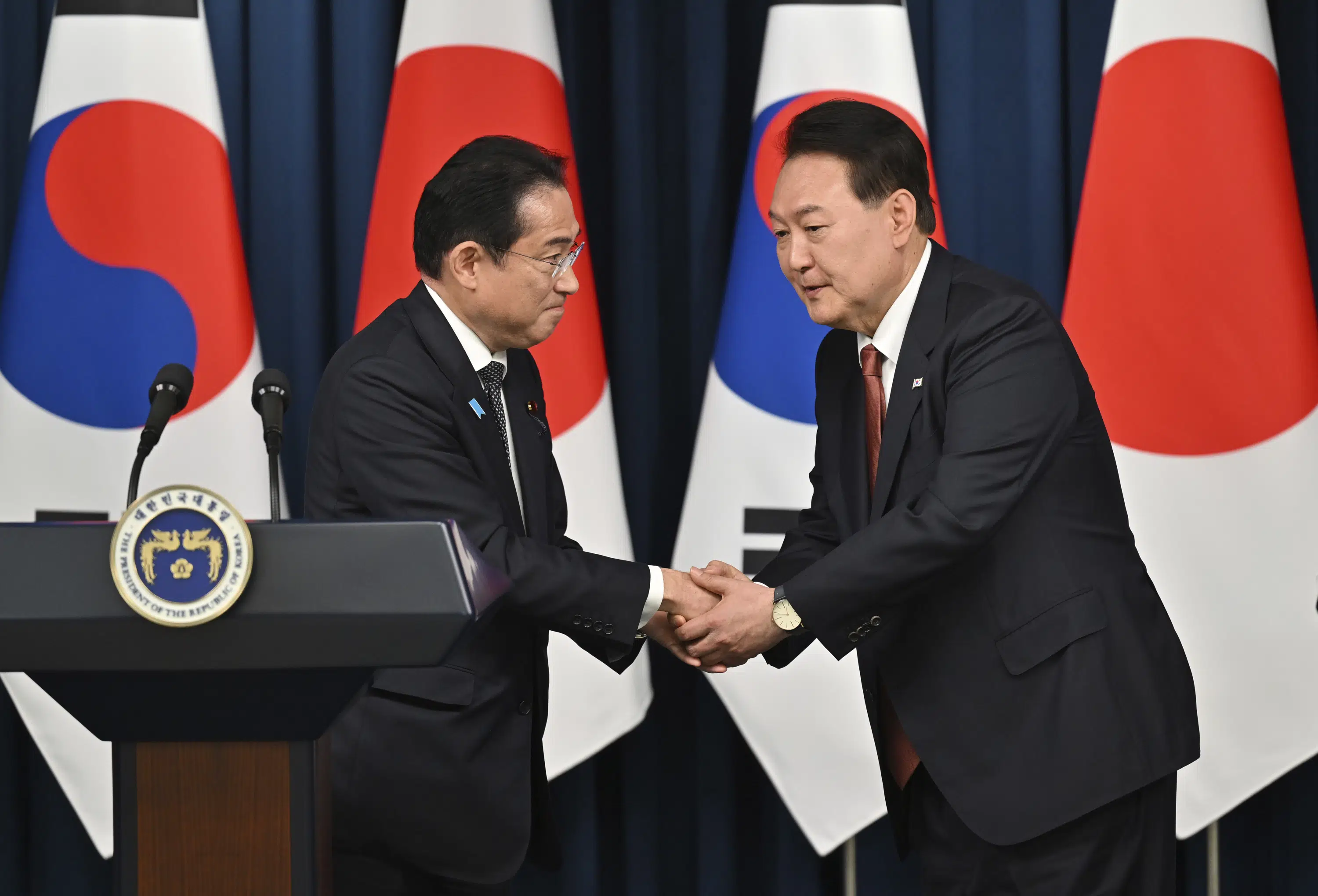 Japan's Kishida strengthens ties with South Korea amid regional tensions.