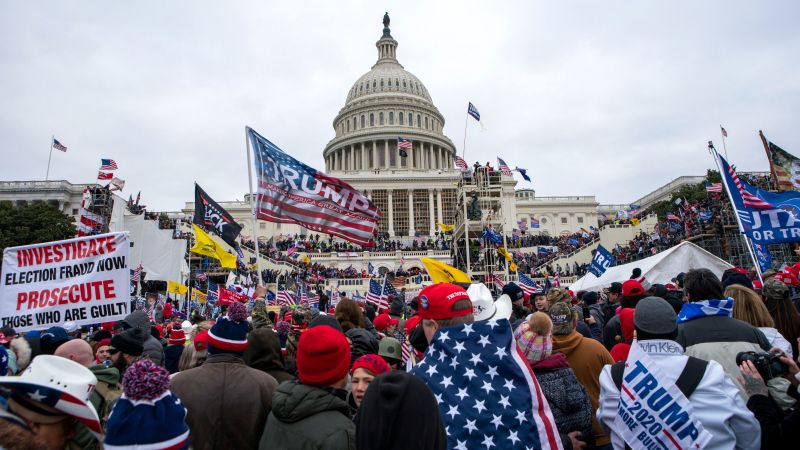 Featured image for Jan. 6 Capitol Rioter Fires Shots at Police During Standoff Ahead of Arrest