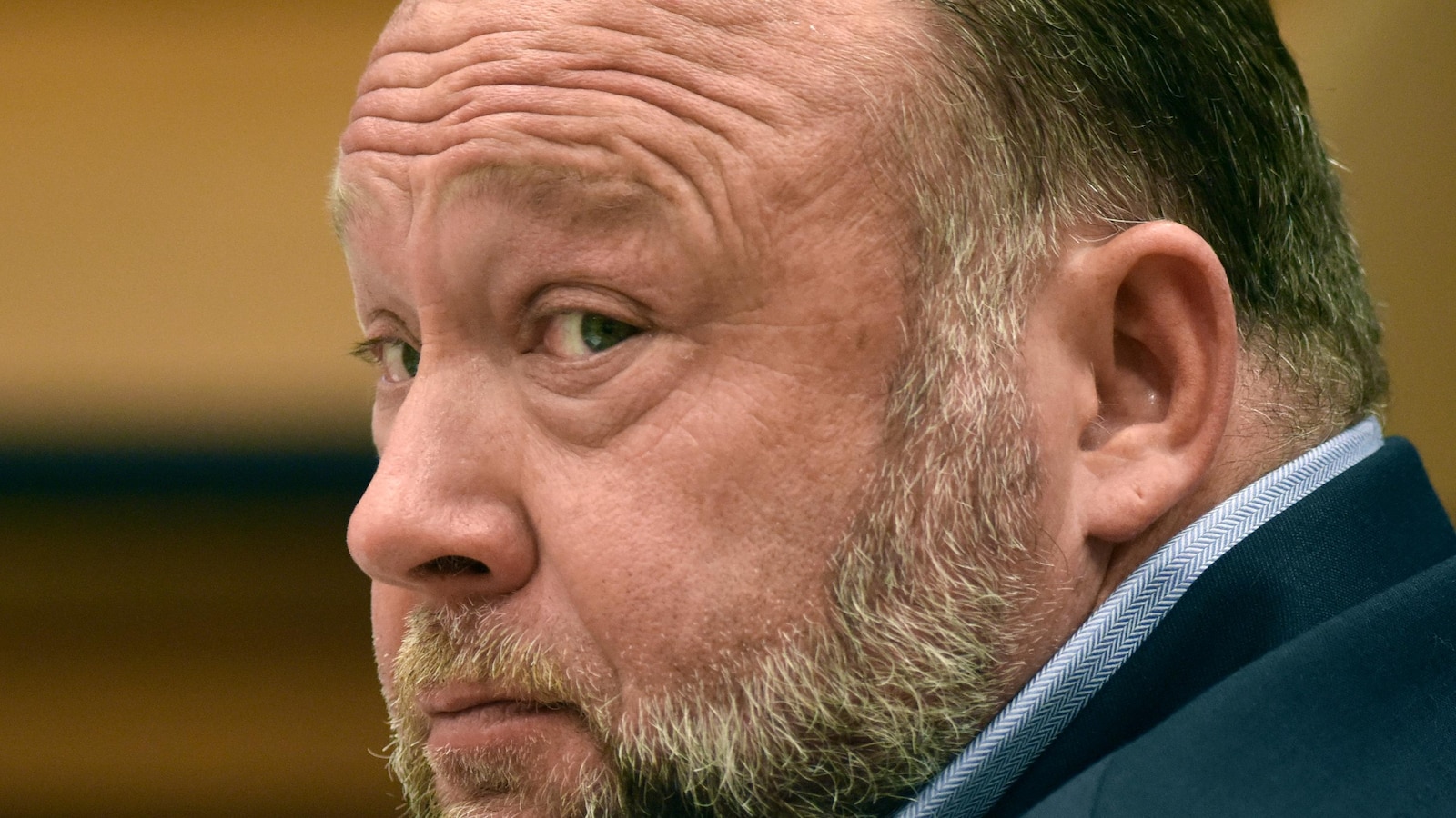 Alex Jones Claims Federal Plot to Shut Down Infowars Amid Financial Turmoil