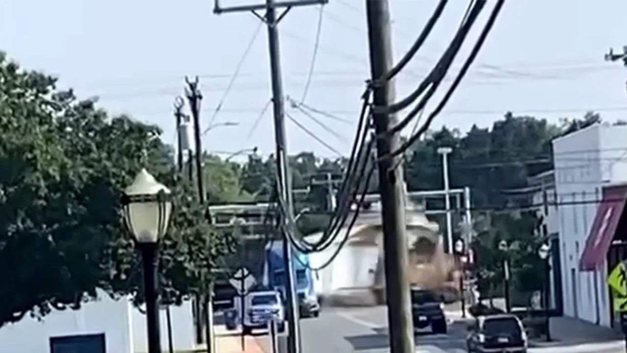 Featured image for Dramatic Video Shows Train Colliding with Semi-Truck on North Carolina Railway Crossing