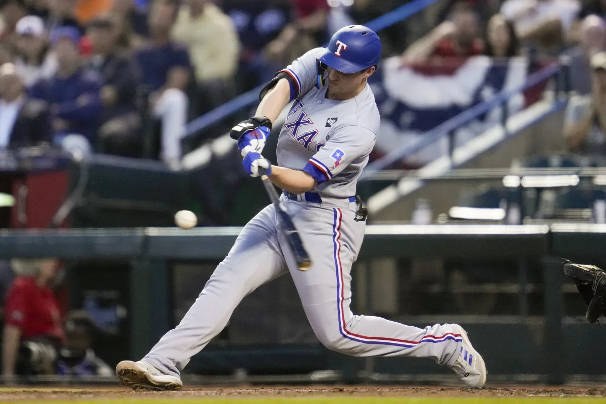 "Rangers Dominate Diamondbacks with 11-Run Victory in World Series Game 4"