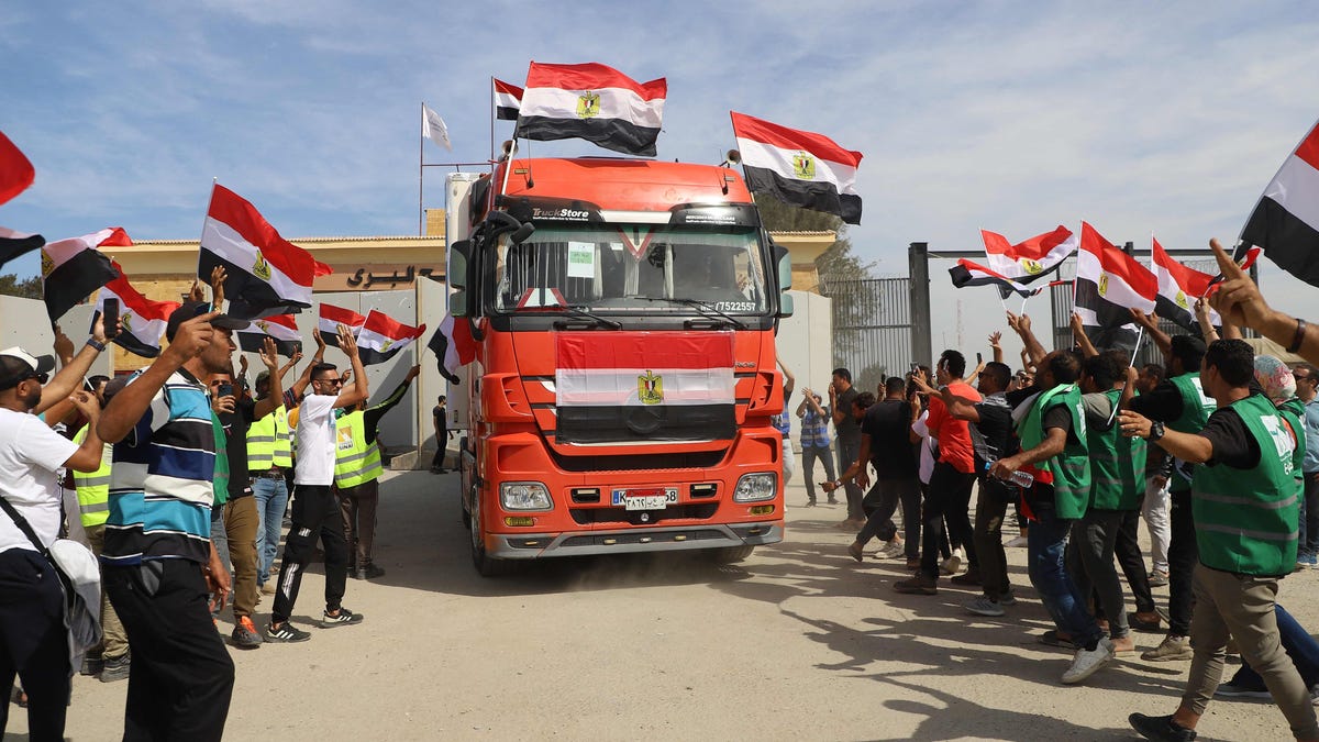 "Israel-Hamas Conflict: Aid Arrives, Hostages Released, and Rockets Fly"