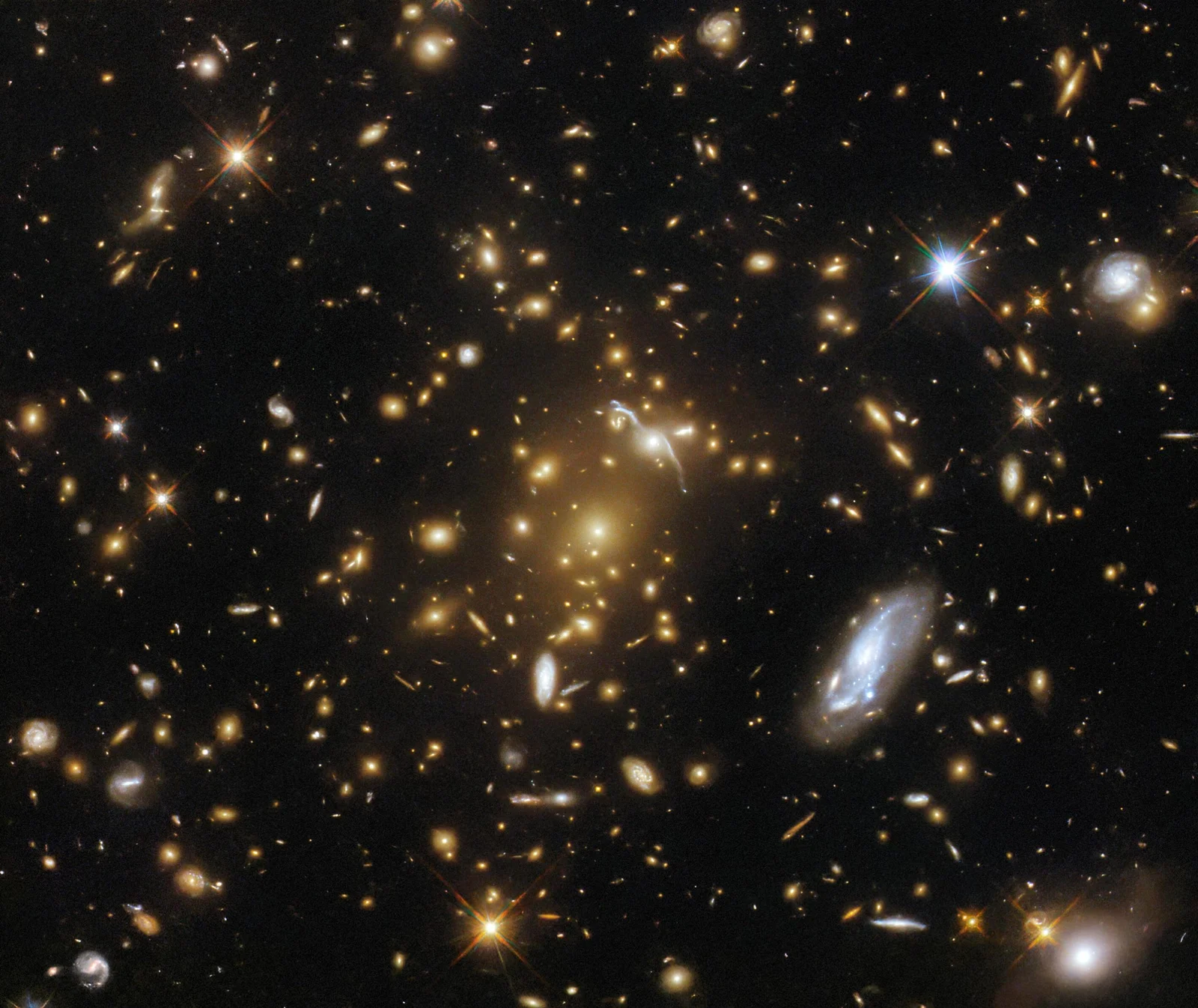 Hubble Discovers Massive Galaxy Cluster.