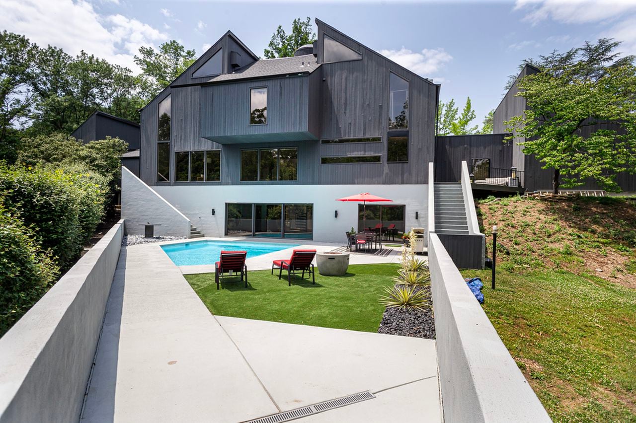 "Tour this $900K Home with a Stunning Spiral Staircase and Swim-Through Pool"