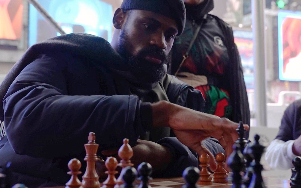 "Nigerian Chess Master Tunde Onakoya's Record-Breaking Marathon in Times Square"