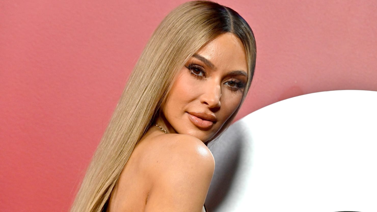 Featured image for "Kim Kardashian's Controversial Tanning Bed Use Sparks Backlash from Doctors and Fans"