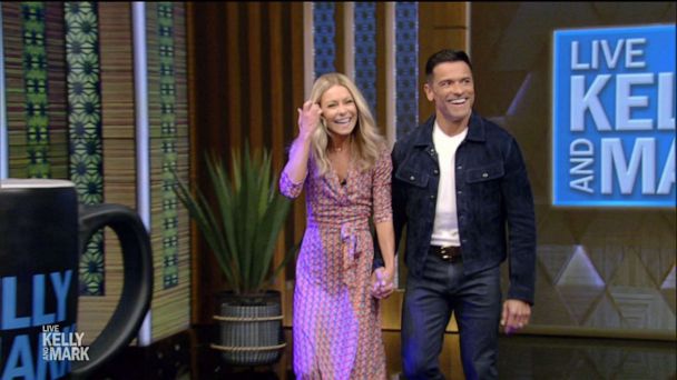 Featured image for Kelly Ripa and Mark Consuelos take on 'Live' co-hosting duties with determination.