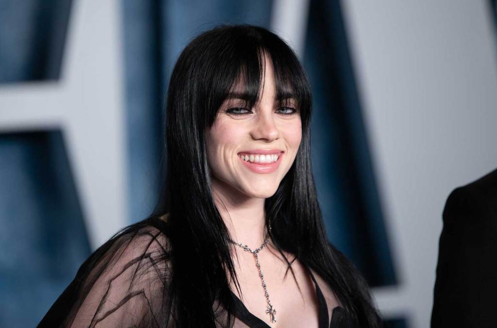 Featured image for Billie Eilish Playfully Flaunts Rare Chest Tattoo in Bikini Photo