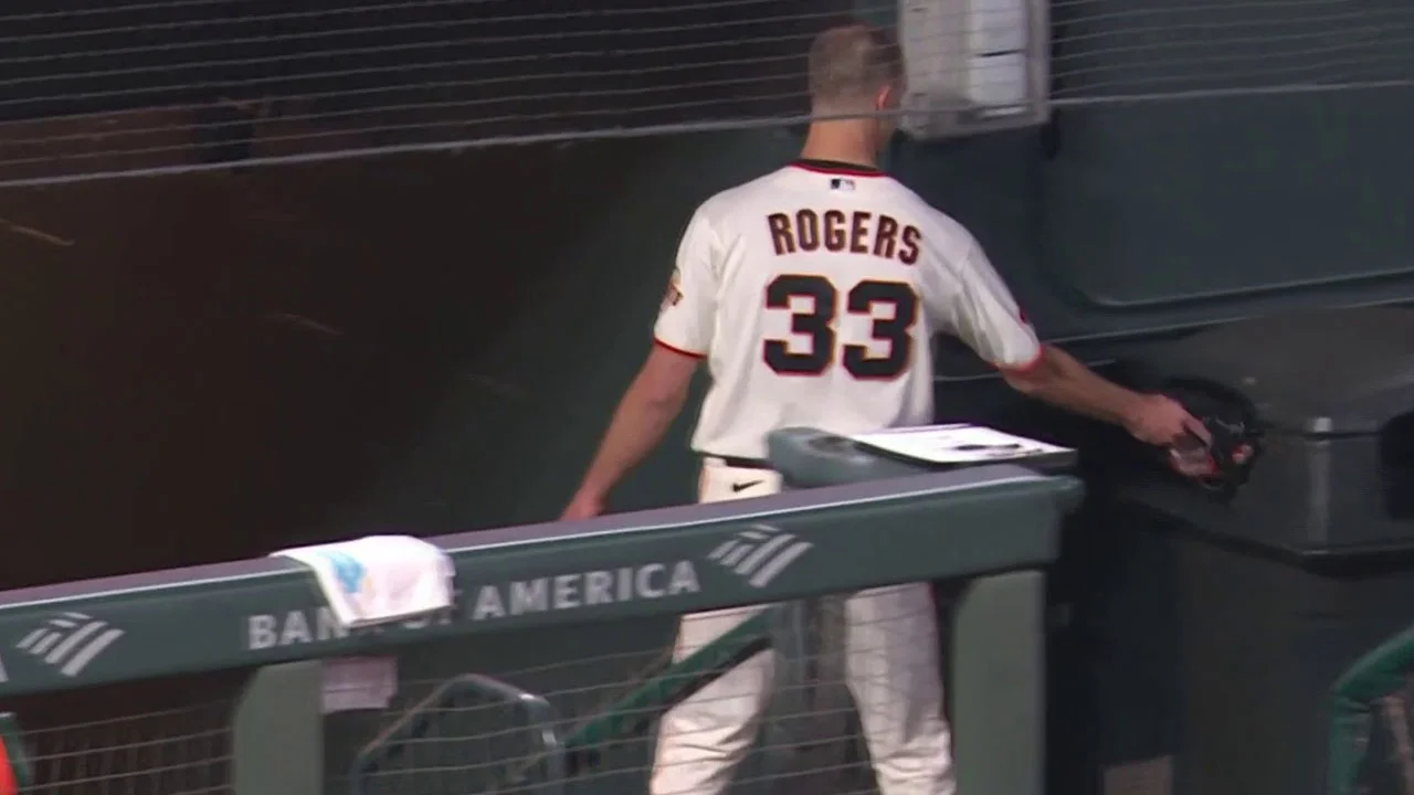 Giants' Rogers Throws Glove in Trash After Dodgers Outing.
