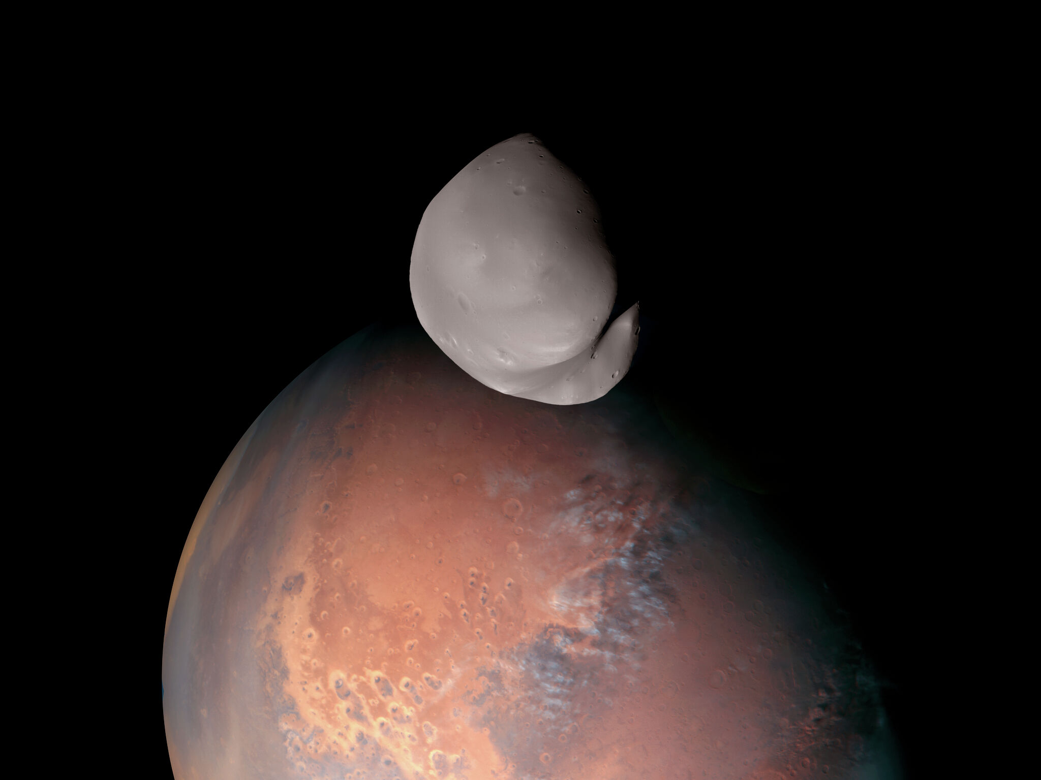Featured image for New data and photos challenge previous theories on Mars' moon Deimos.