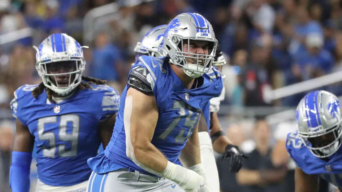 John Cominsky's Life-Changing T-Shirt Leads to Big Lions Deal.