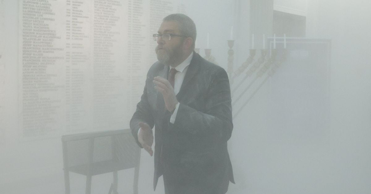 Far-right Polish lawmaker extinguishes Hanukkah candles in parliament
