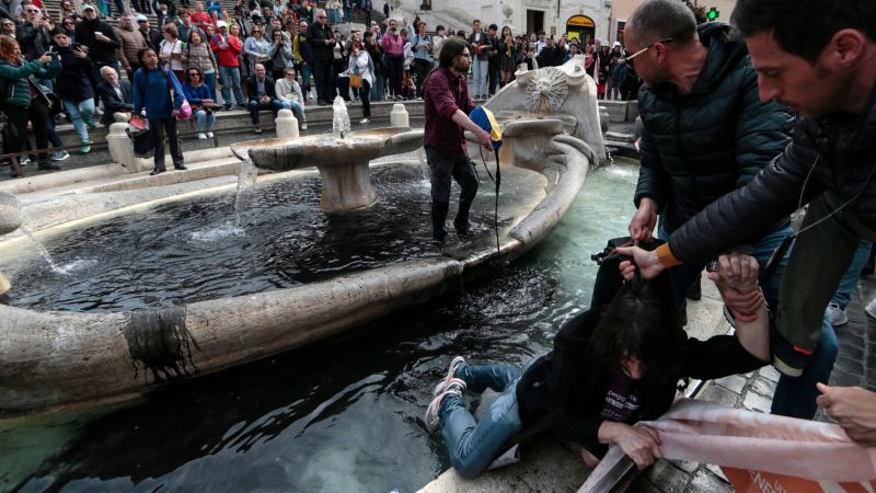 Featured image for Climate Activists Dye Rome's Landmark Fountain Black in Protest.