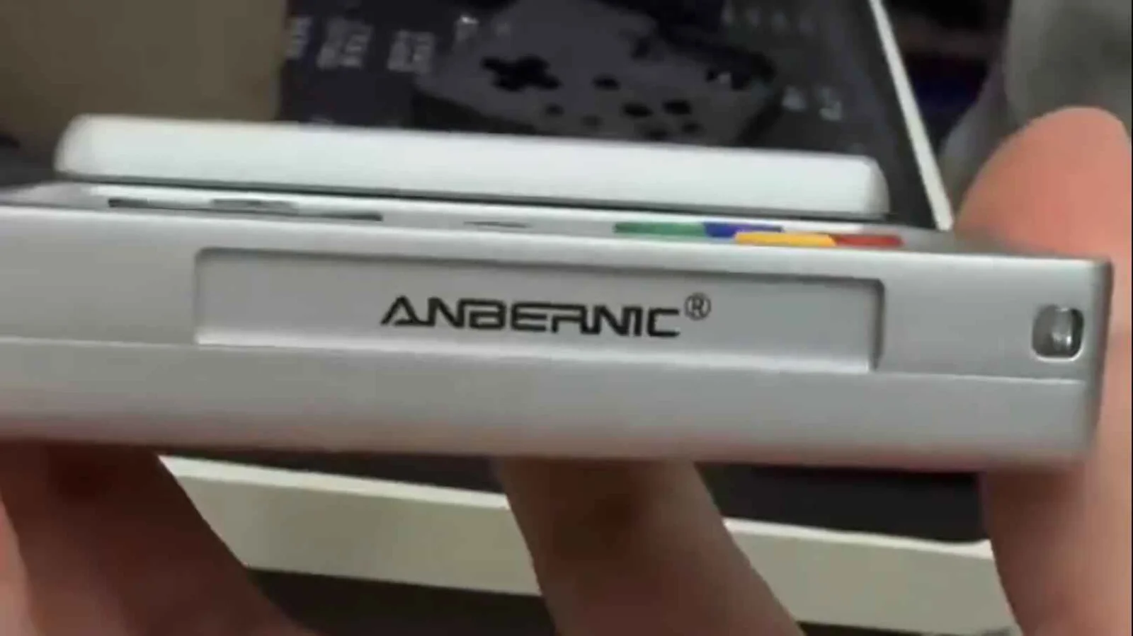 Anbernic Teases Rotating-Screen Handheld That Unfolds into a Game Pad