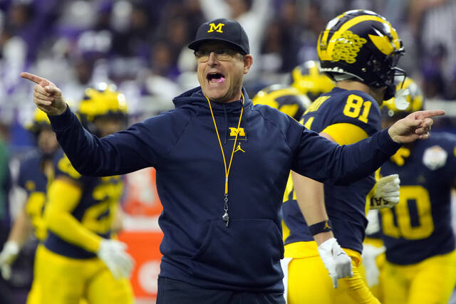 "Michigan Coach Jim Harbaugh Faces 4-Game Suspension for NCAA Rule Violations: AP Source"