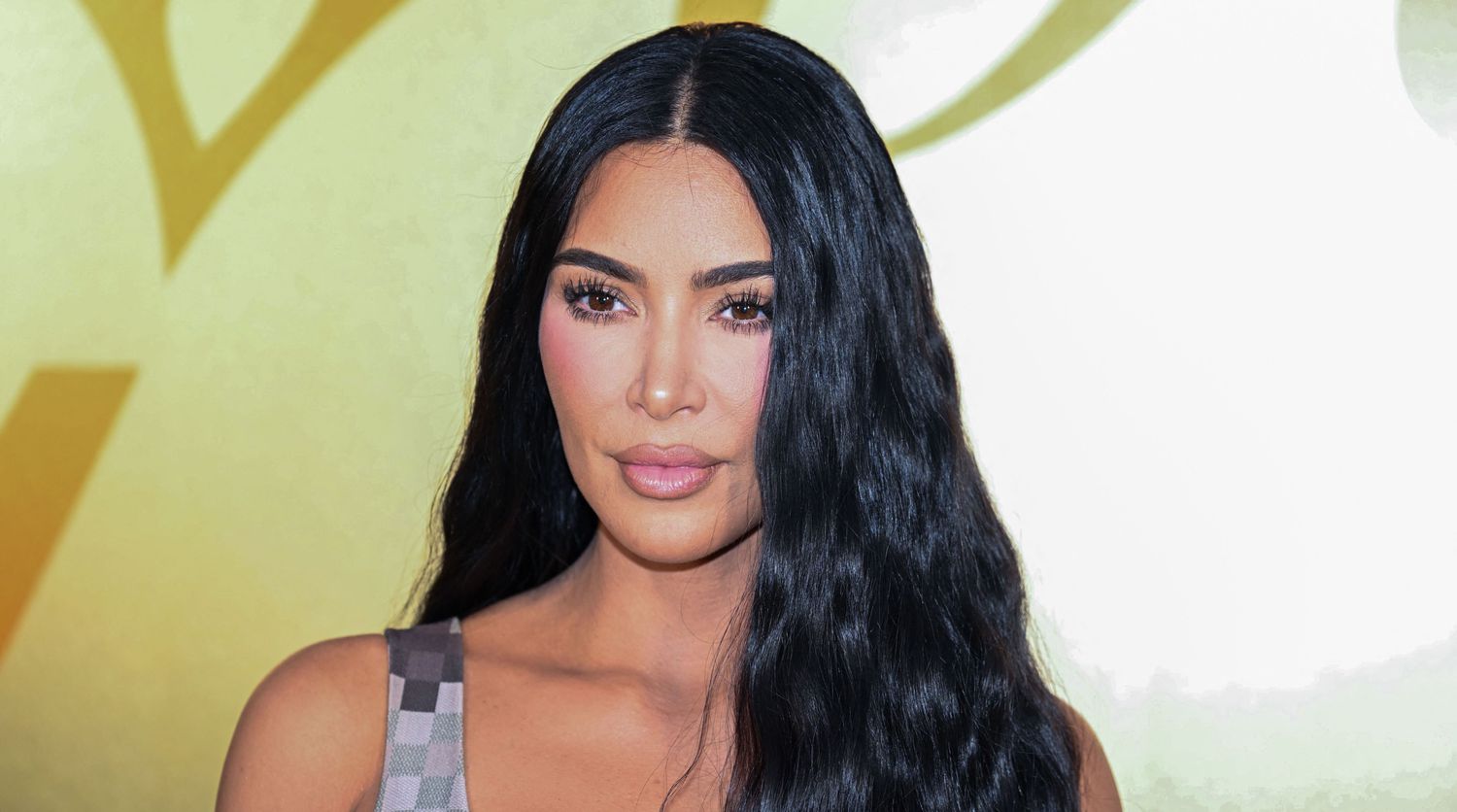 Kim Kardashian Flaunts Itty-Bitty Blue Bikini and Sends Fans a Reminder