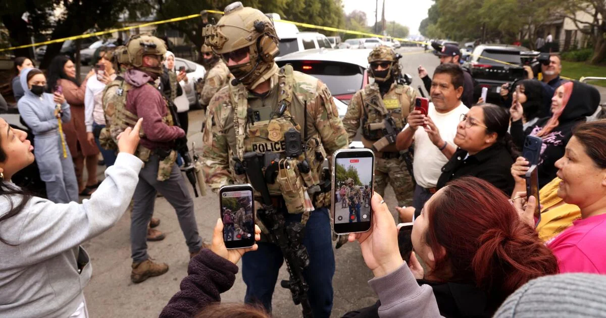 Vehicle ram and gunfire mark LA immigration raid as crowd watches