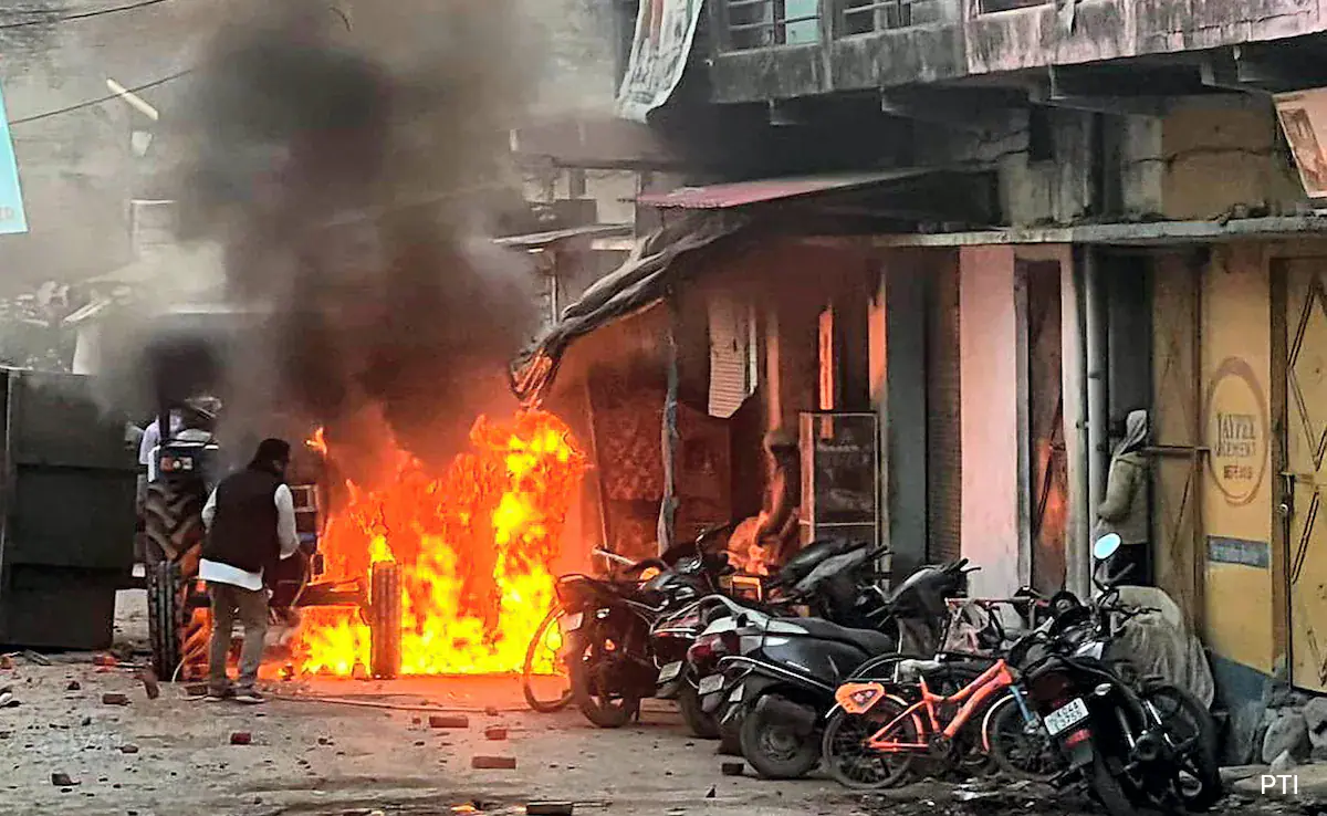 Featured image for "Deadly Clashes and Curfew: Unrest Grips Uttarakhand as Violence Erupts"
