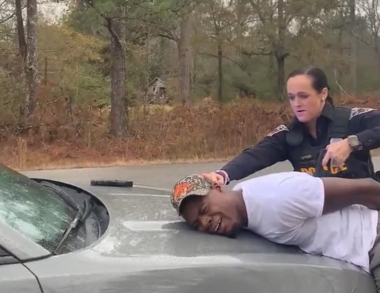 Featured image for "Alabama Police Use Stun Gun on Handcuffed Black Man Changing Tire, Sparks Outrage"
