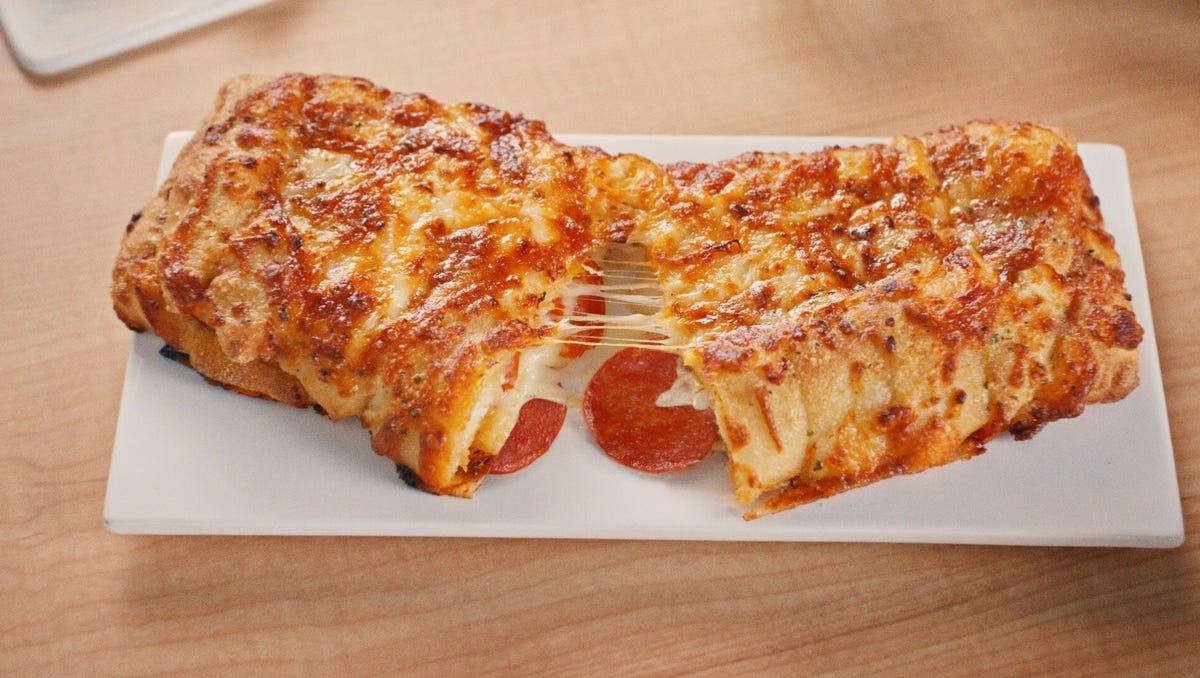 Featured image for "Domino's Unveils Mouthwatering Pepperoni-Stuffed Cheesy Bread Delight"