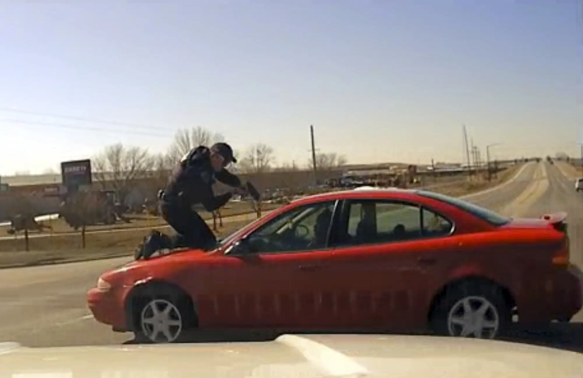 Iowa Officer Clings to Fleeing Car in Dramatic Chase