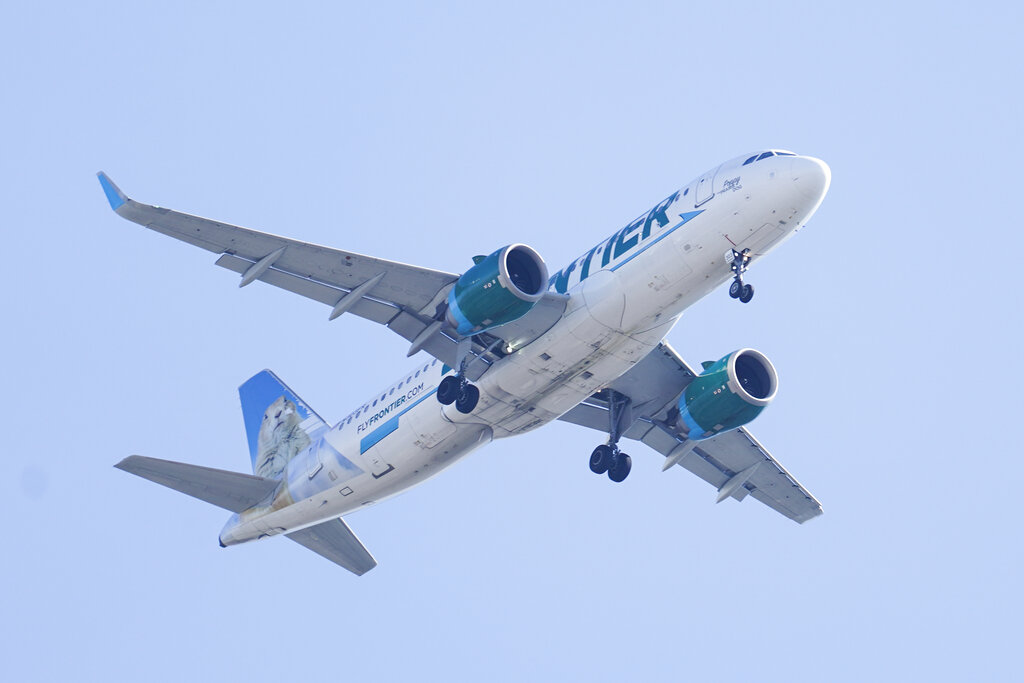 Frontier Airlines passenger arrested for hitting flight attendant with intercom phone.
