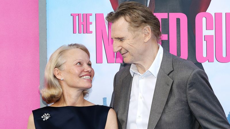 Featured image for Pamela Anderson and Liam Neeson Spark Romance Rumors and Public Displays of Affection