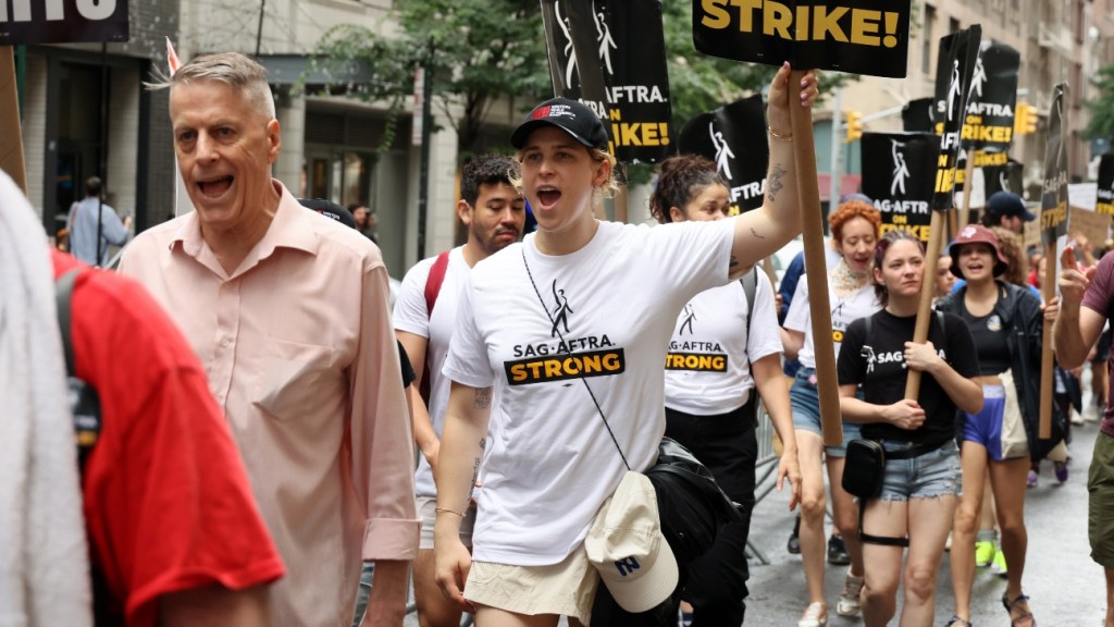 Featured image for "Tommy Dorfman Exposes Meager Earnings on '13 Reasons Why': Fueling the Strike"