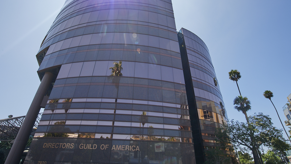 Featured image for DGA approves tentative contract with studios, including AI and residuals.