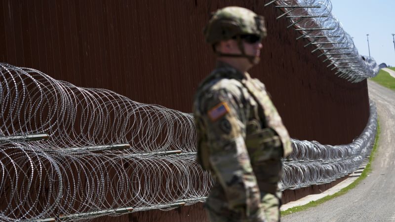 Featured image for U.S. to paint southern border wall black to deter climbers, DHS confirms