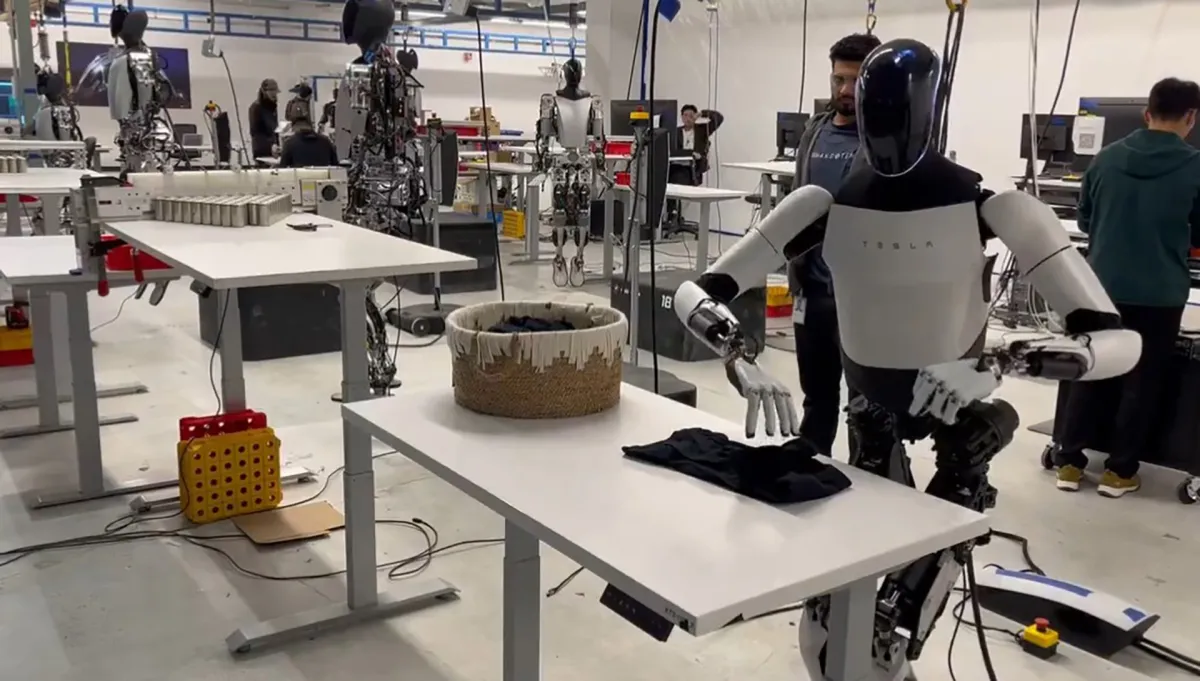 "Elon Musk's Tesla Optimus Bot Wows with Laundry-Folding Skills"