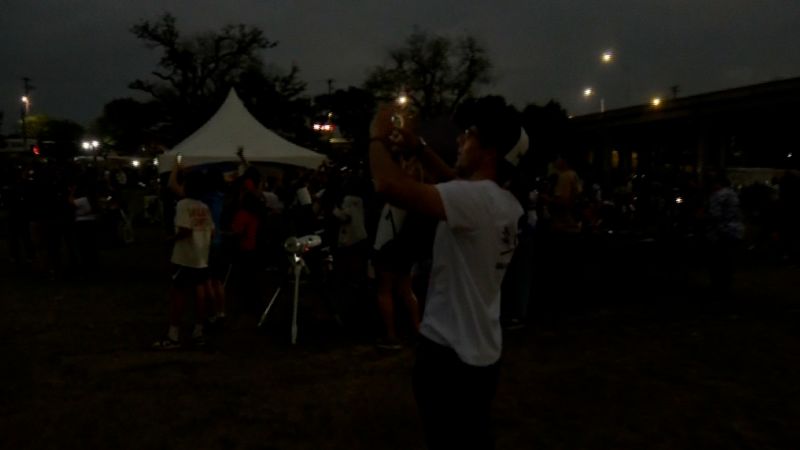 Featured image for "Capturing the Spectacle: Witness the Crowd's Total Darkness During Eclipse"