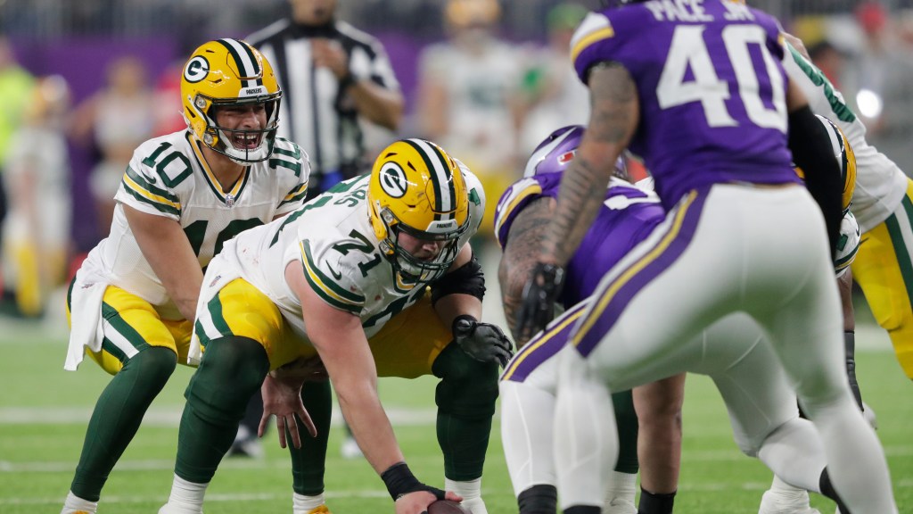 Featured image for "Packers Dominate Vikings in Trenches as Ravens Clinch with Jackson's Improbable Throws"