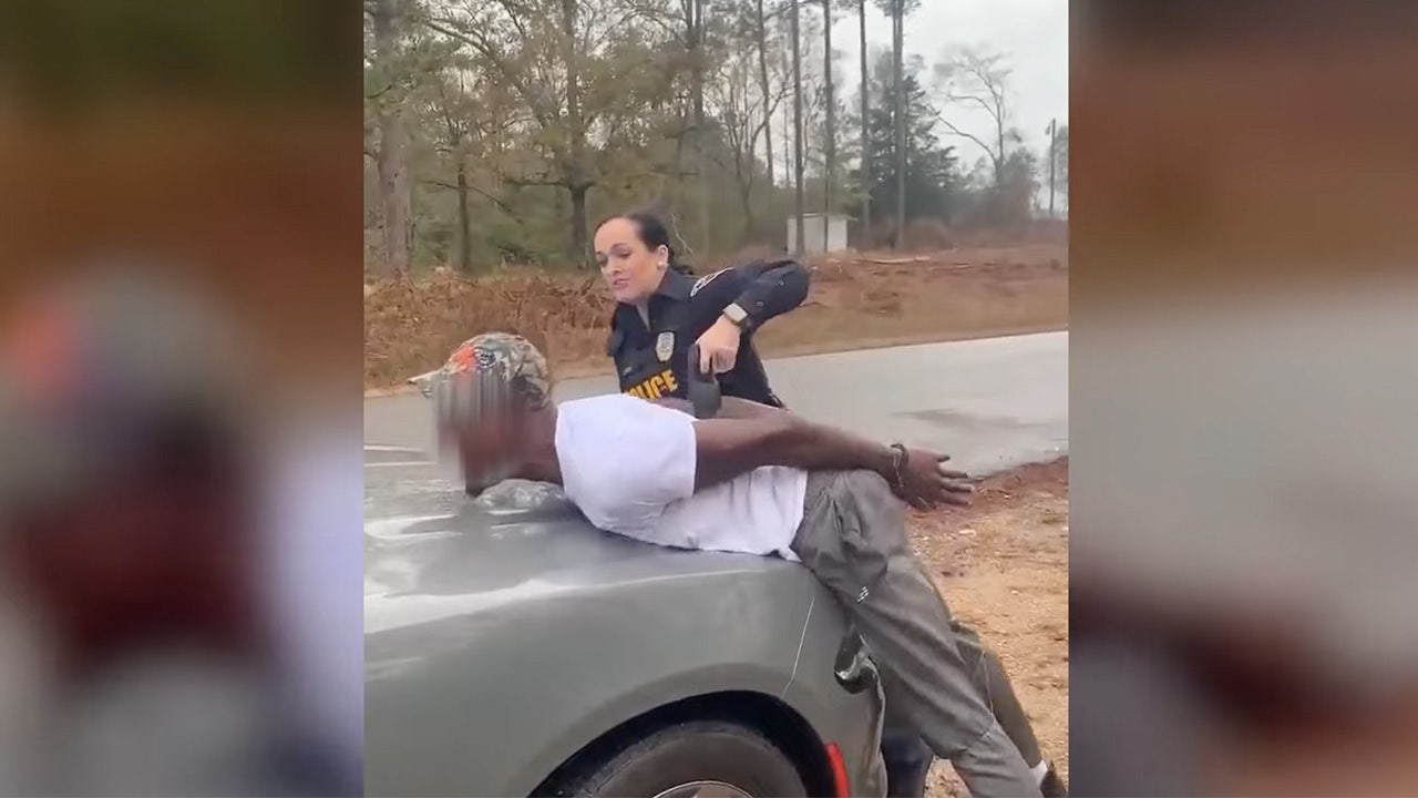 Featured image for Alabama Police Officer Under Investigation for Using Stun Gun on Handcuffed Man Changing Tire