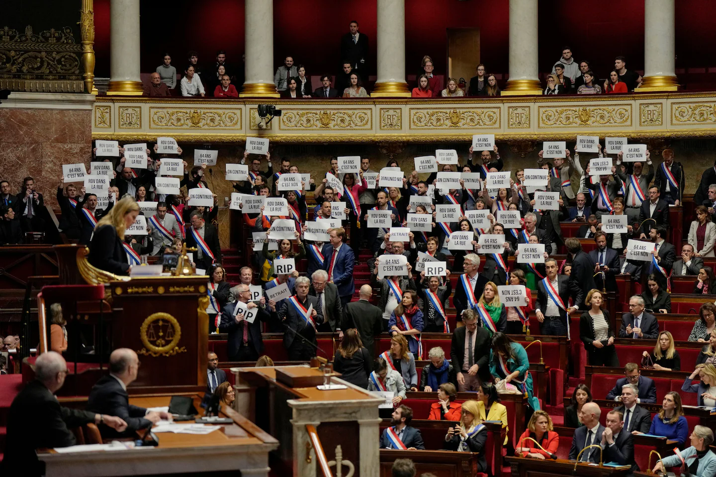 Macron survives no-confidence vote amidst pension reform protests.