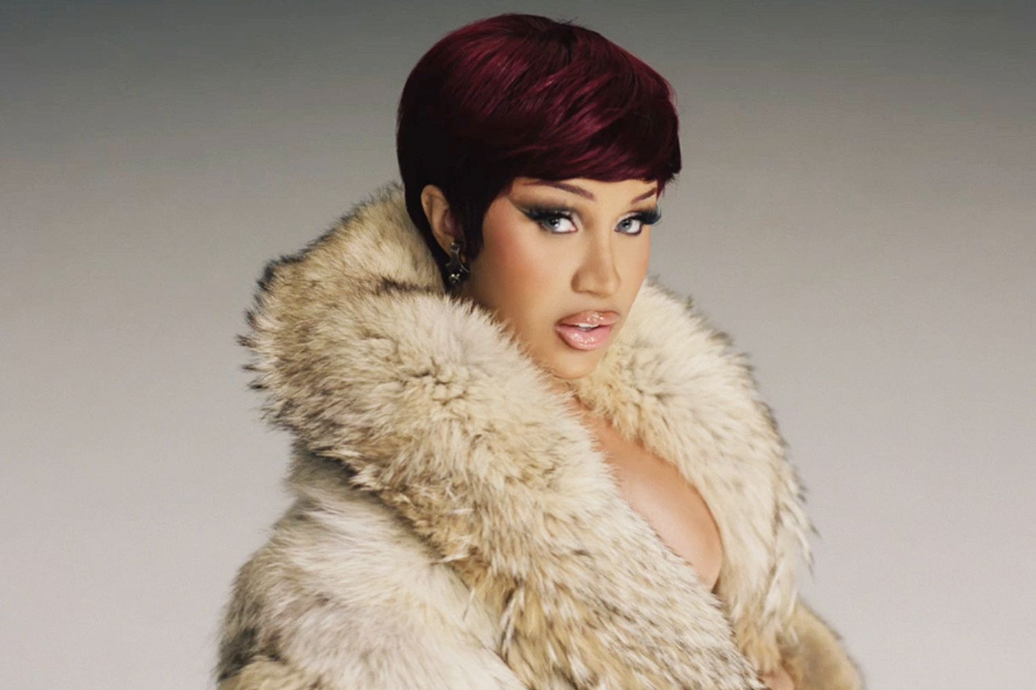 "Cardi B's Stylish Transformations in 'Enough (Miami)' Music Video"