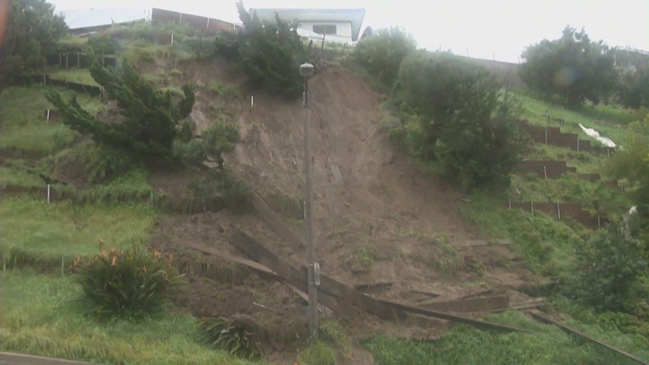 Rain-triggered mudslides threaten Baldwin Hills homes and block traffic.