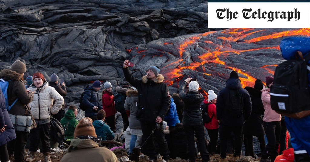 Featured image for "Drone Footage Captures Daredevils Risking It All Over Iceland's Erupting Volcano"